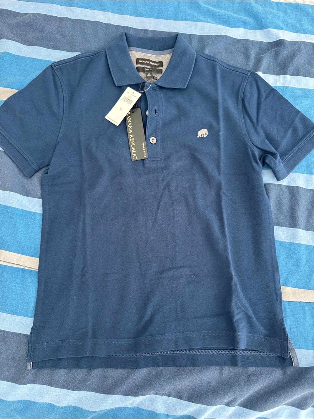 Banana Republic Men’s Dark Blue Polo with Ivory Elephant Logo